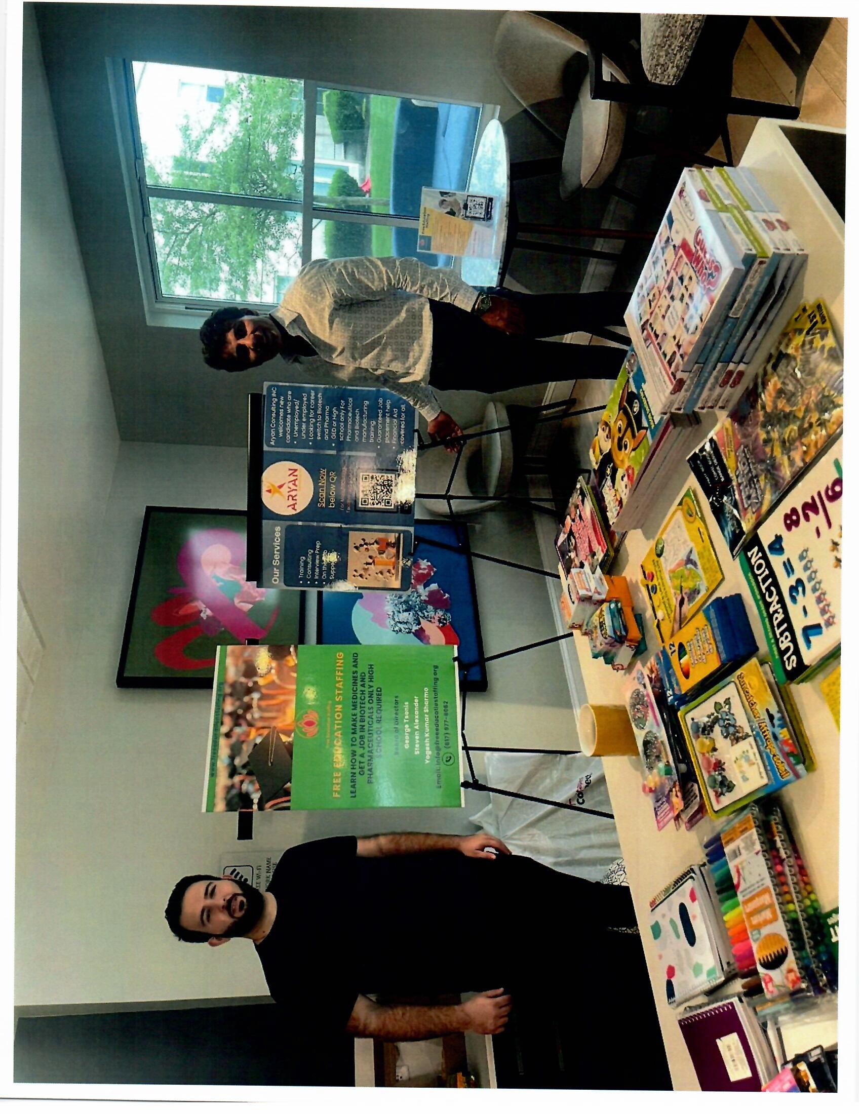 Community outreach table with Free Education Staffing materials
