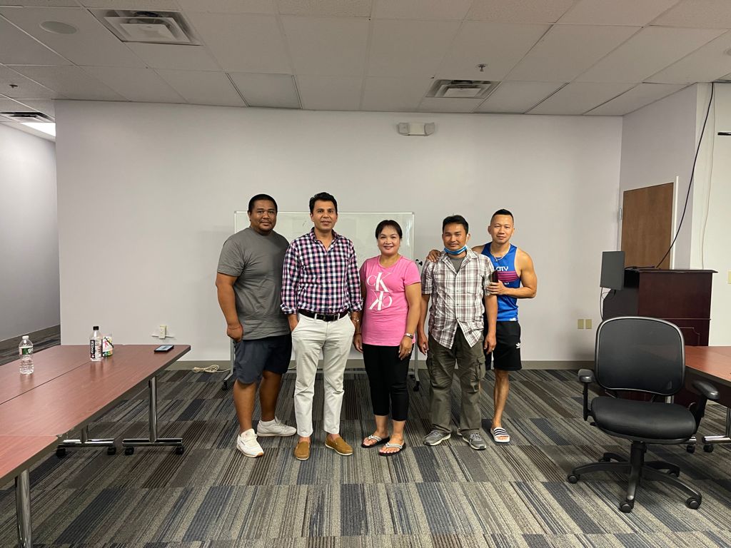Free Education Staffing training cohort and instructors in a meeting room